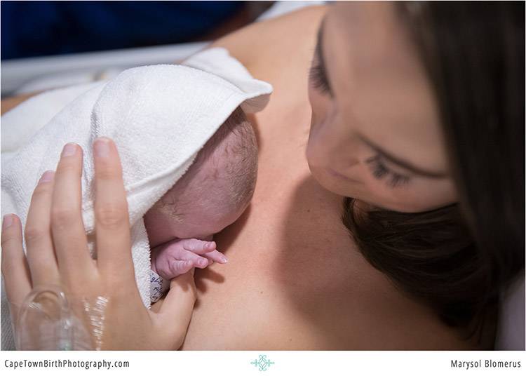 Baby being held just after birth